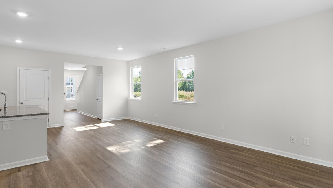 The flexible first floor includes a versatile guest room, office or playroom as well as a full bath across the hall!