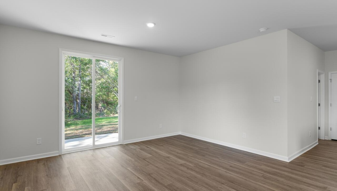 The flexible first floor includes a versatile guest room, office or playroom as well as a full bath across the hall!