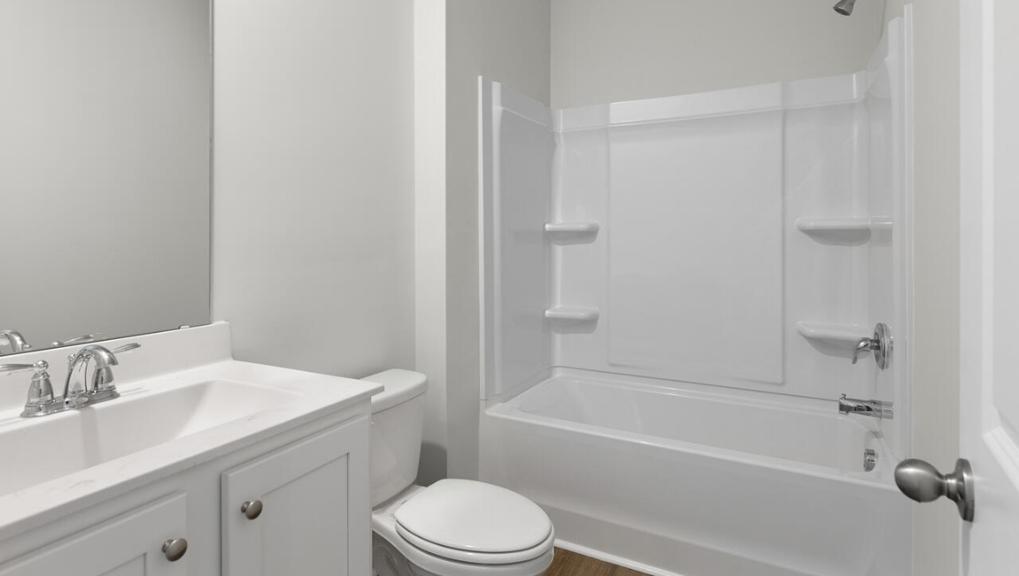 The flexible first floor includes a versatile guest room, office or playroom as well as a full bath across the hall!