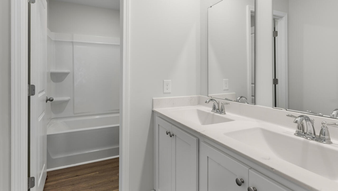 Our renowned Woodstock floor plan features 4 bedrooms, 3 full baths, and spans 2,361 sq. ft. This home provides a guest room or office on the ground floor along with the primary suite and 2 additional bedrooms upstairs.