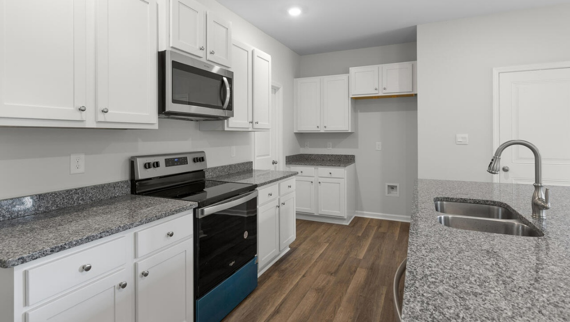 granite countertops in the kitchen, and cultured marble in the bathrooms.