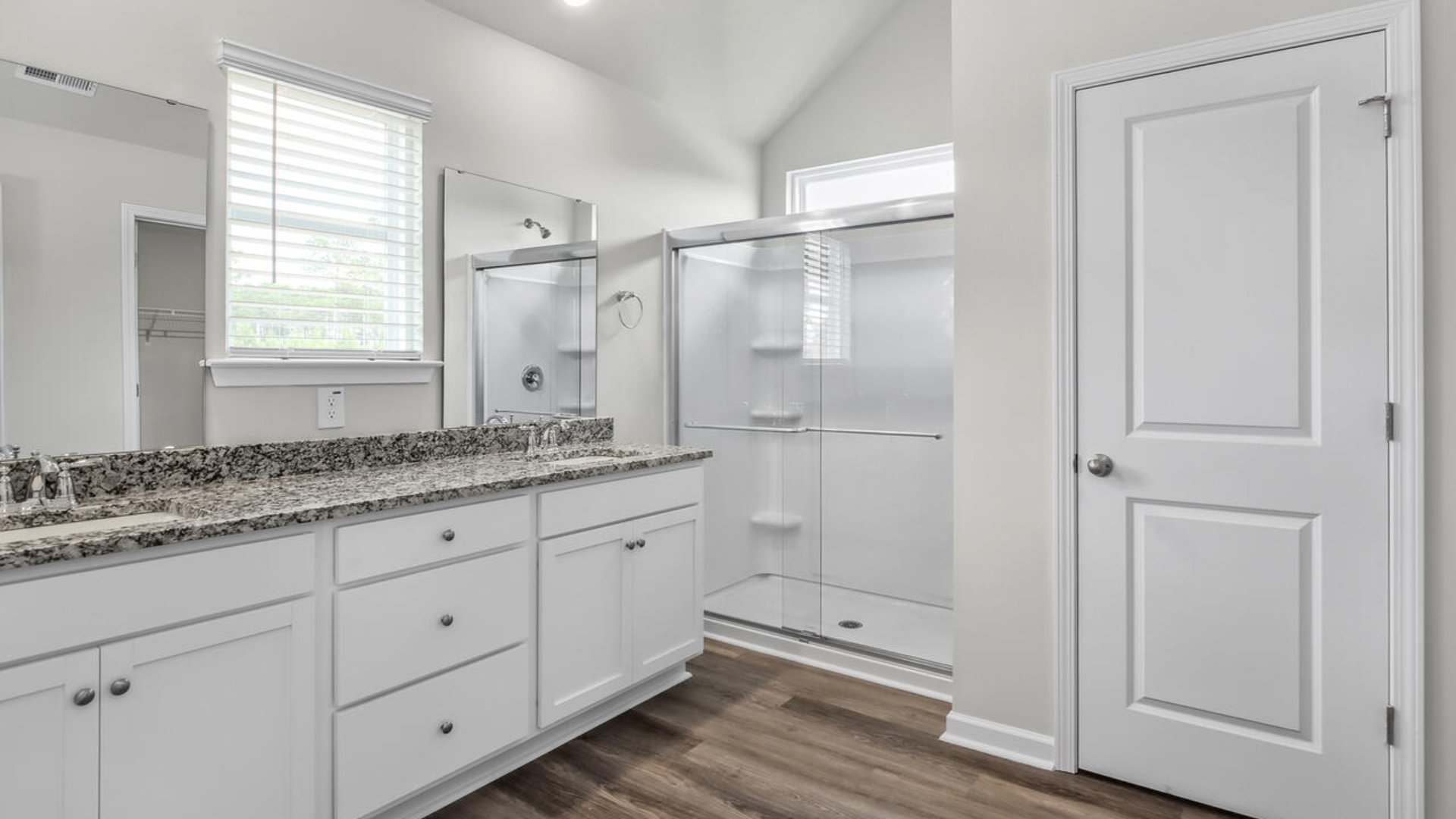 The guest suite on the first floor provides comfort and privacy for visitors, as well as a full bath.