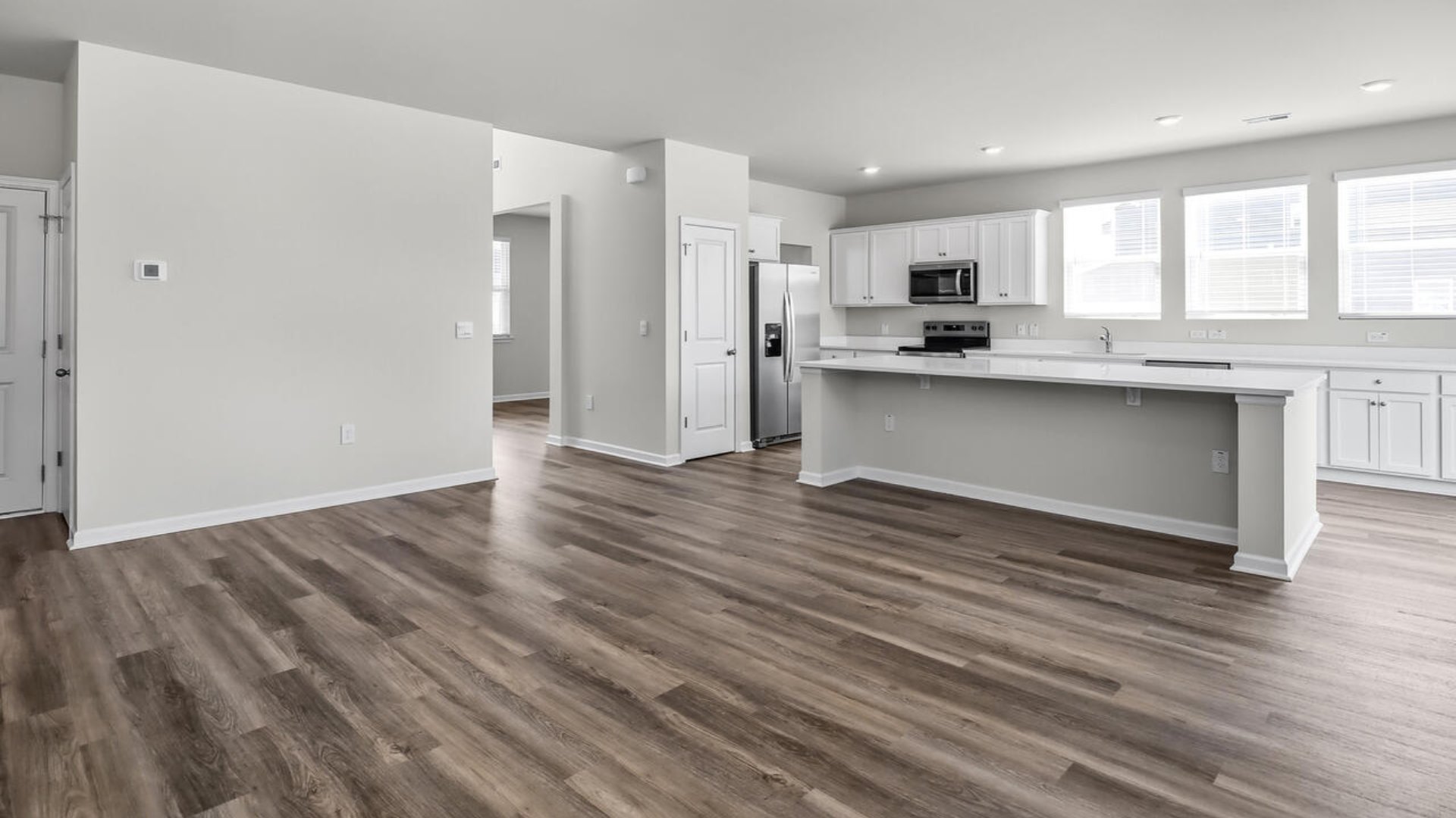 On the first floor on this Forrester floorplan, the formal dining room is ideally located next to a spacious open concept living area and kitchen