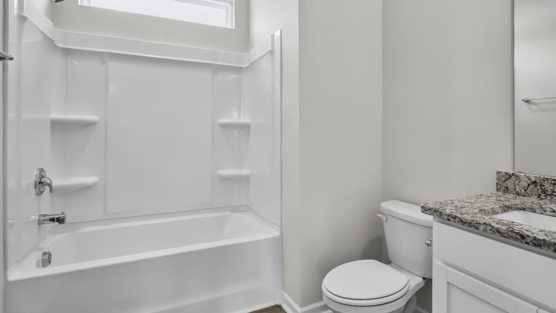 The guest suite on the first floor provides comfort and privacy for visitors, as well as a full bath.