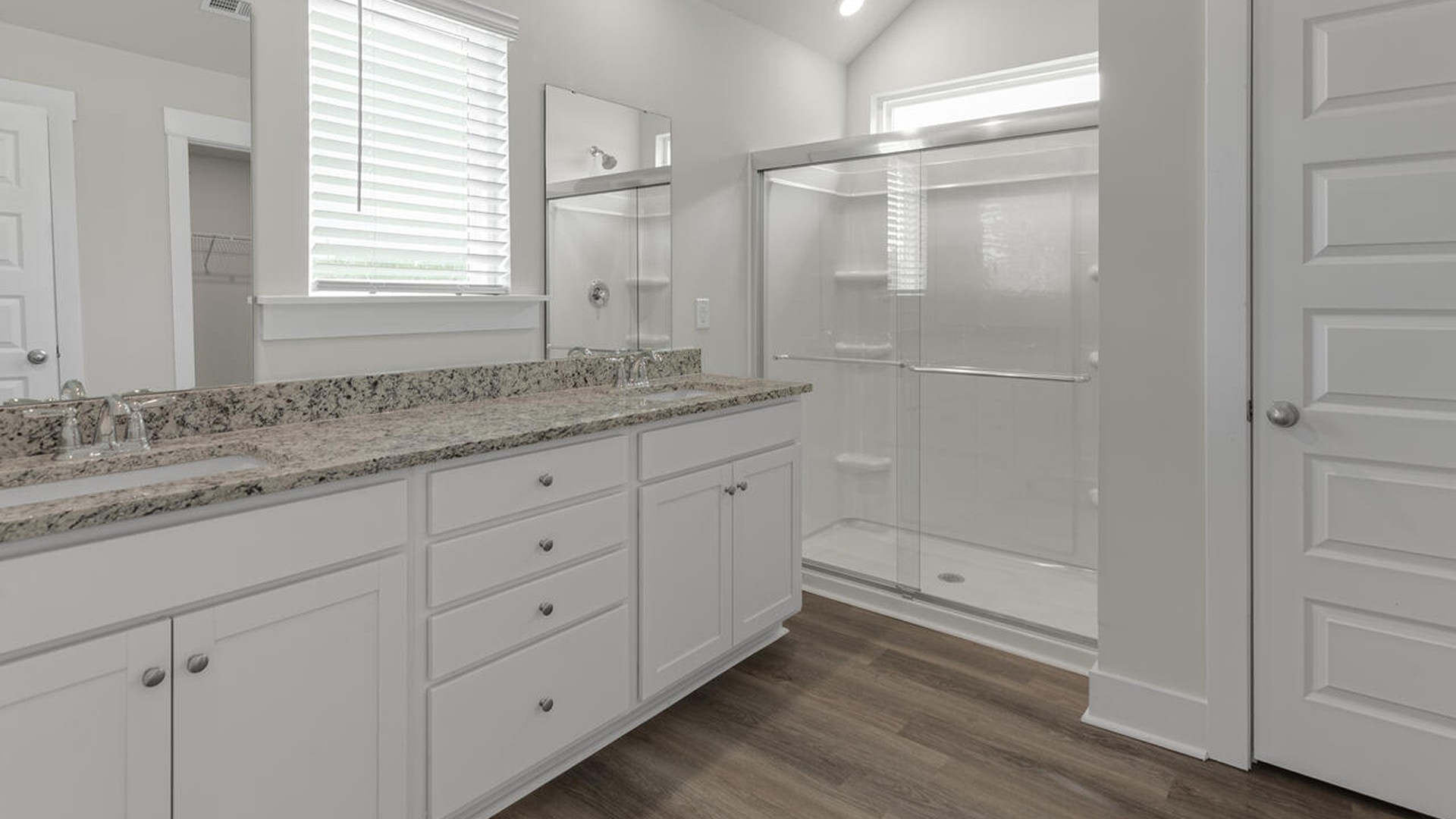 Ascending to the second floor, you'll find a luxurious primary retreat with a generous walk-in closet, a conveniently located laundry room, and a versatile bonus room suitable for various purposes.