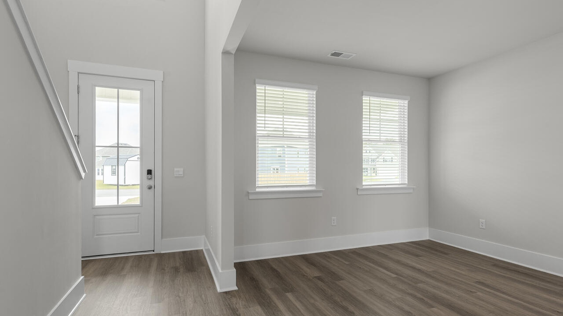On the first floor, the formal dining room is ideally located next to a spacious open-concept living area and kitchen, allowing for effortless interaction with guests while preparing meals.
