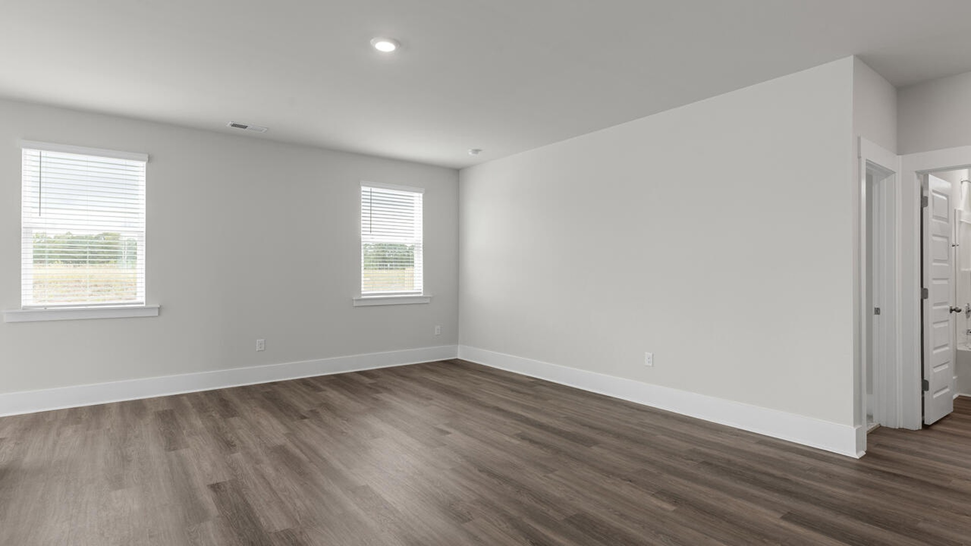 On the first floor, the formal dining room is ideally located next to a spacious open-concept living area and kitchen, allowing for effortless interaction with guests while preparing meals.