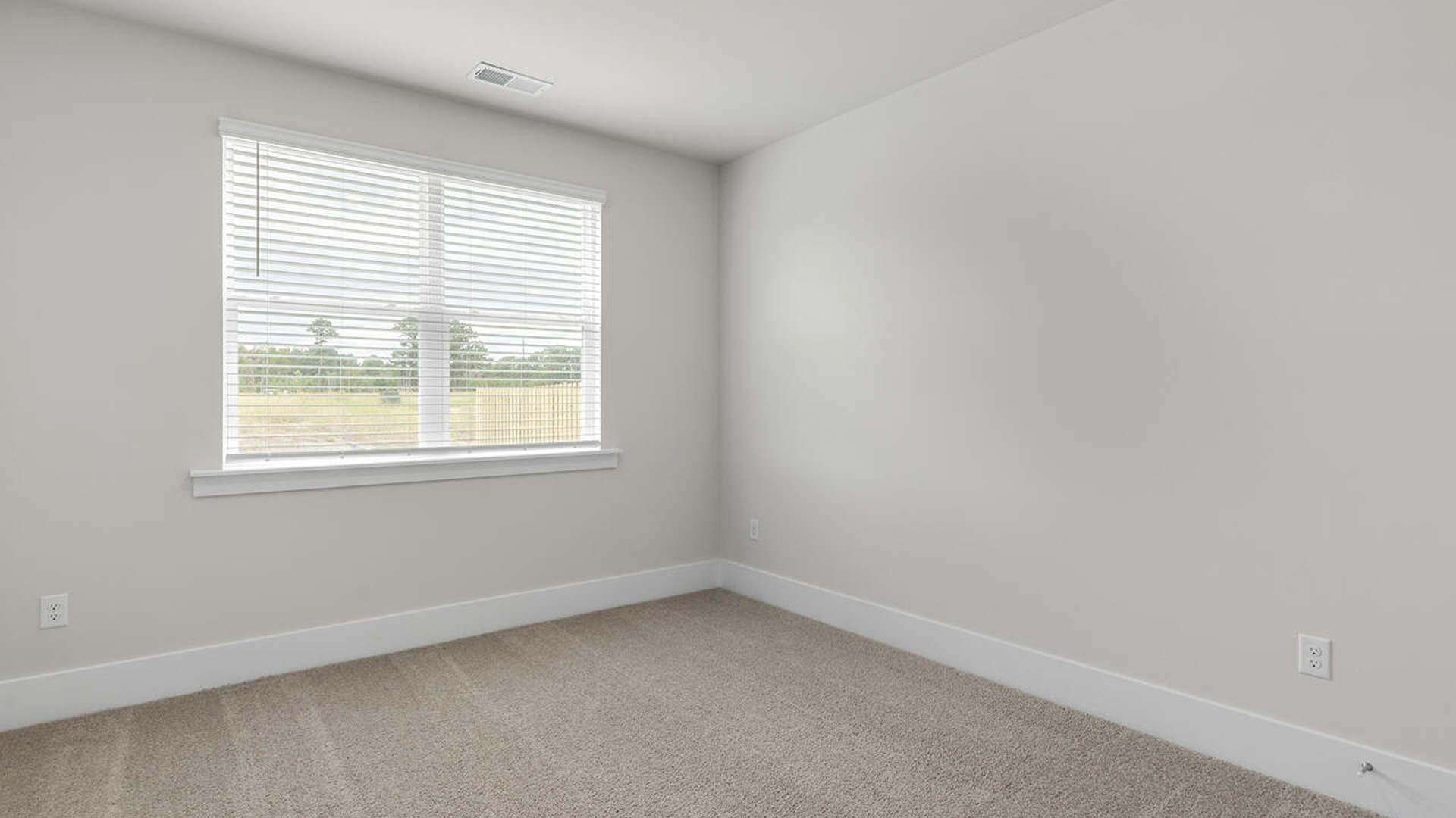 On the first floor, the formal dining room is ideally located next to a spacious open-concept living area and kitchen, allowing for effortless interaction with guests while preparing meals.