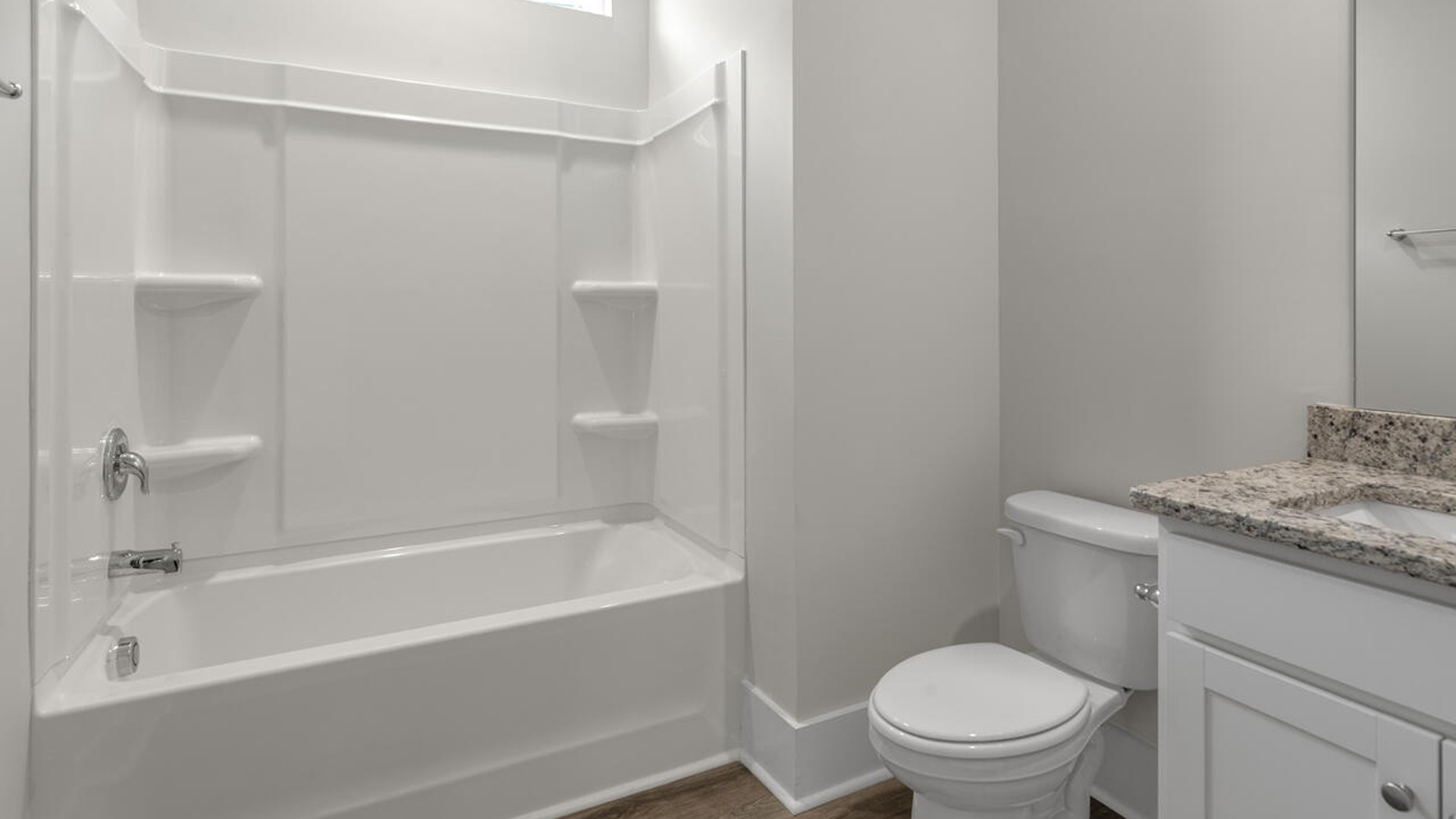 The guest suite on the first floor provides comfort and privacy for visitors, as well as a full bath.