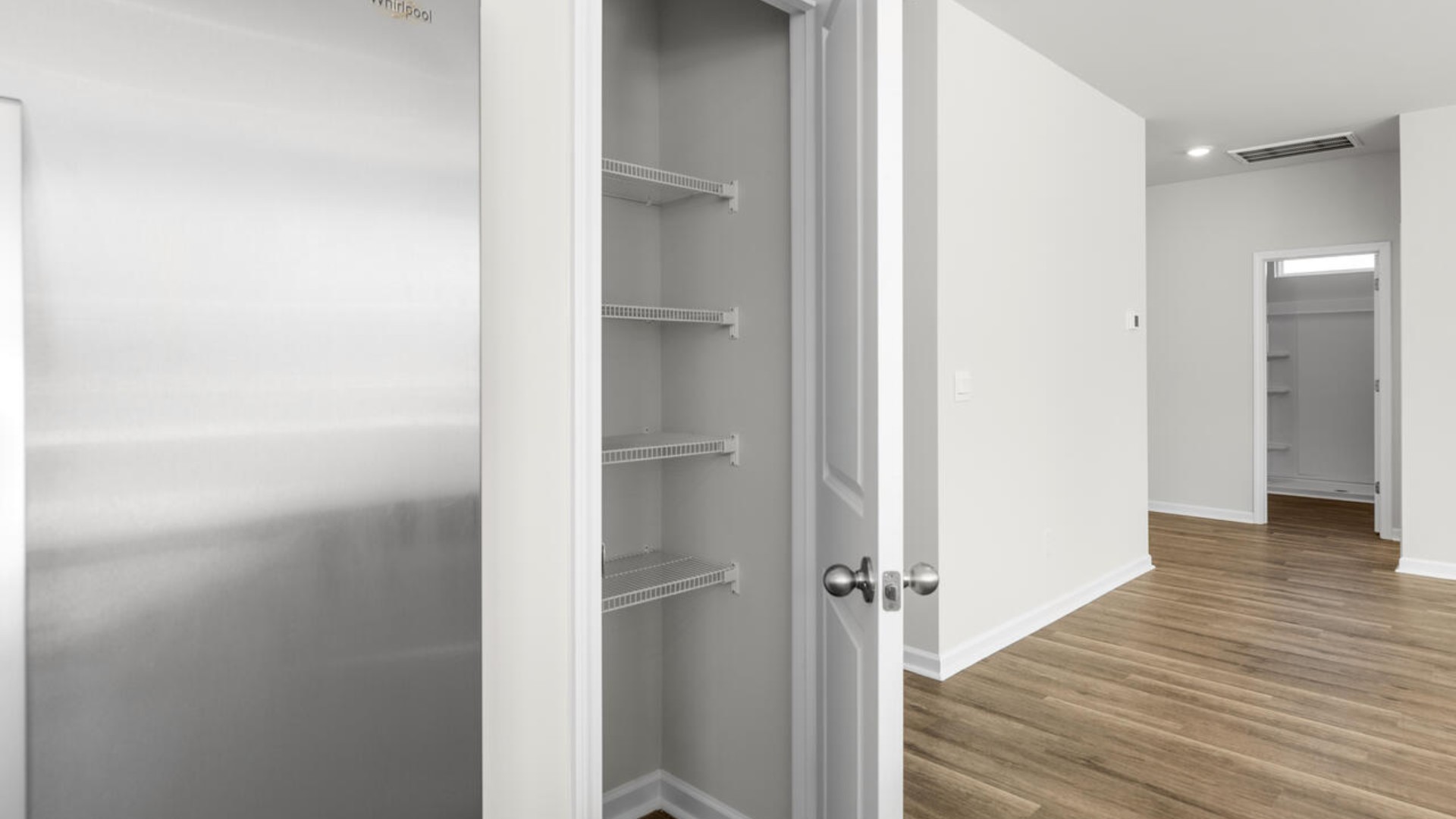 Open floor plan with giant granite island open large gourmet kitchen with 36'' cabinets with crown molding, granite countertops, tile backsplash, and pantry, and stainless-steel appliances in kitchen. Separate dining room just right for entertaining.