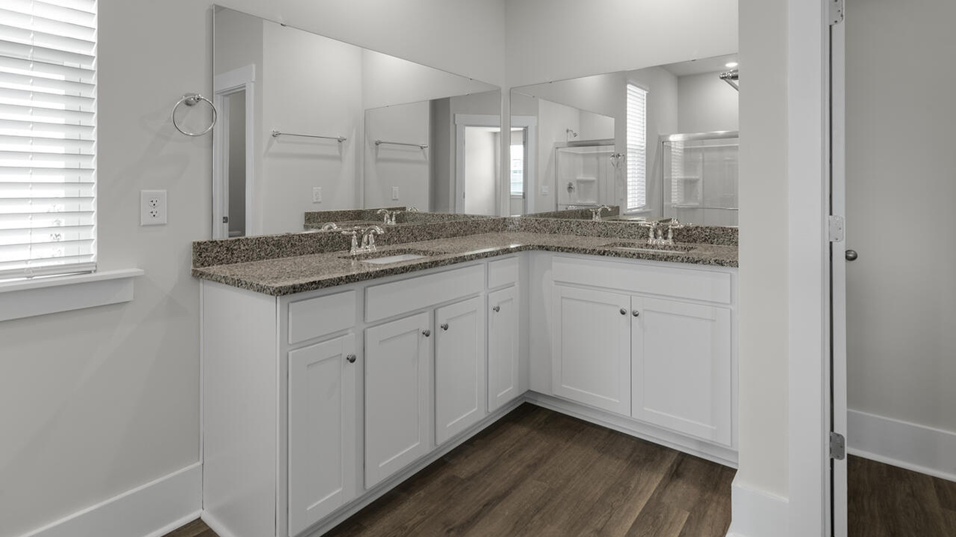 The primary bedroom, conveniently located on the main floor, offers a private retreat with easy access to the living areas.