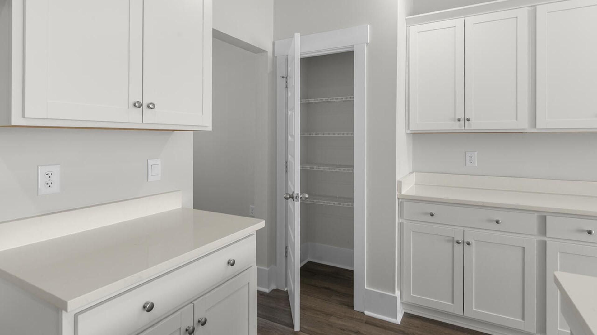 As you enter the home you will find a formal dining room, open concept kitchen and family room with additional seating at the large kitchen island, and a first floor primary bedroom retreat.