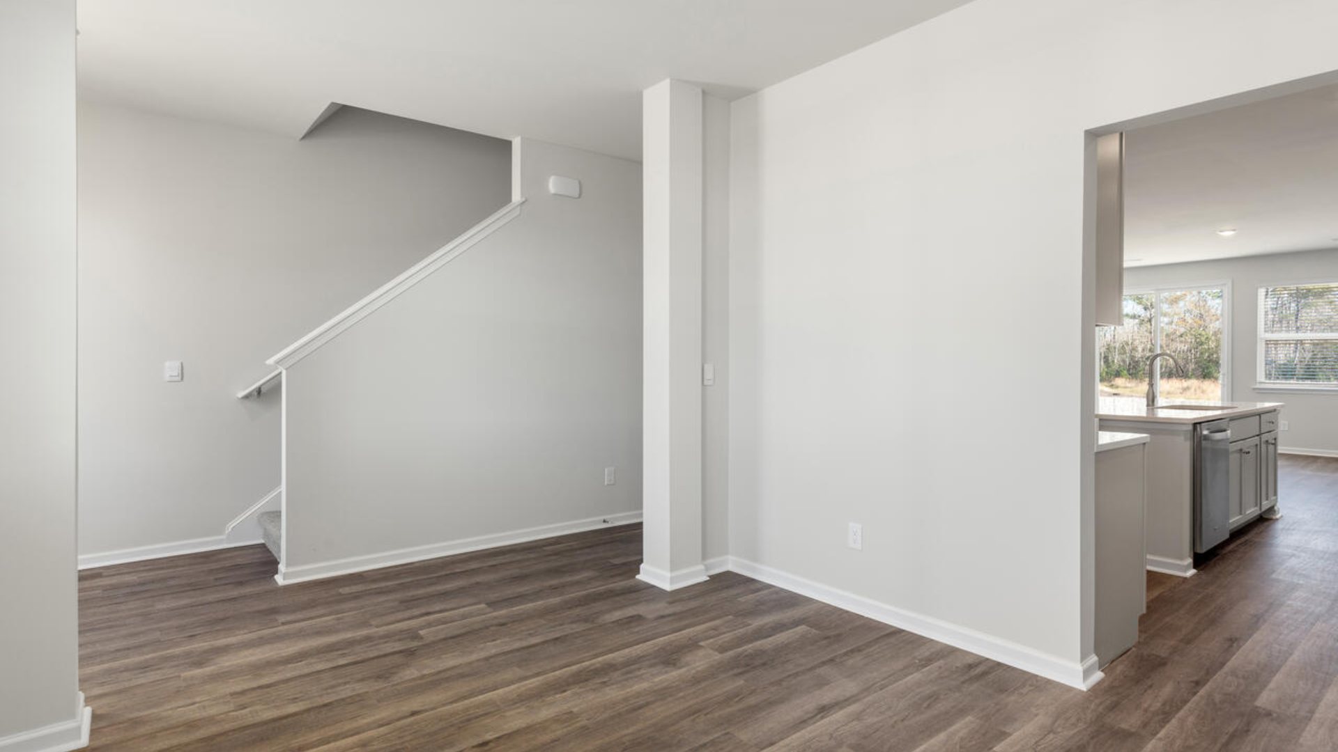 As you enter the home you will find a formal dining room, open concept kitchen and family room with additional seating at the large kitchen island, and a first floor primary bedroom retreat.