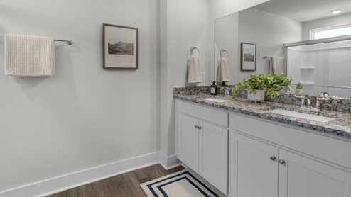 This home provides a guest room or office on the ground floor along with the primary suite and 2 additional bedrooms upstairs. It includes a generous upstairs loft that can serve as an entertainment area, play space, or office. The Woodstock comes with a 2-car garage.