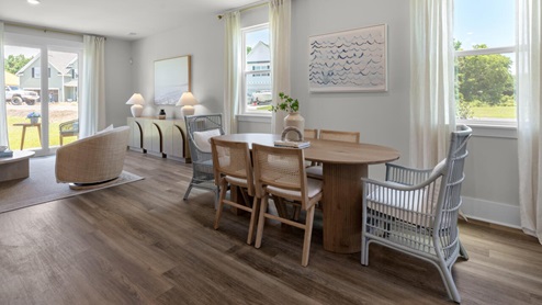 The kitchen features shaker-style cabinets, granite countertops, and stainless steel appliances, which are sure to both turn heads and make meal prep easy. You’ll never be too far from the action with the living and dining area right there.
