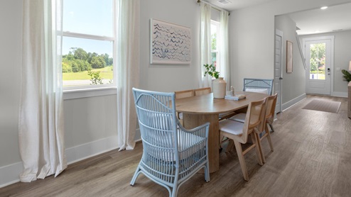 The kitchen features shaker-style cabinets, granite countertops, and stainless steel appliances, which are sure to both turn heads and make meal prep easy. You’ll never be too far from the action with the living and dining area right there.
