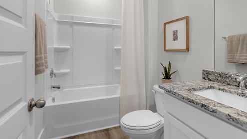 This home provides a guest room or office on the ground floor along with the primary suite and 2 additional bedrooms upstairs. It includes a generous upstairs loft that can serve as an entertainment area, play space, or office. The Woodstock comes with a 2-car garage.