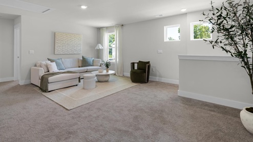 This home provides a guest room or office on the ground floor along with the primary suite and 2 additional bedrooms upstairs. It includes a generous upstairs loft that can serve as an entertainment area, play space, or office. The Woodstock comes with a 2-car garage.