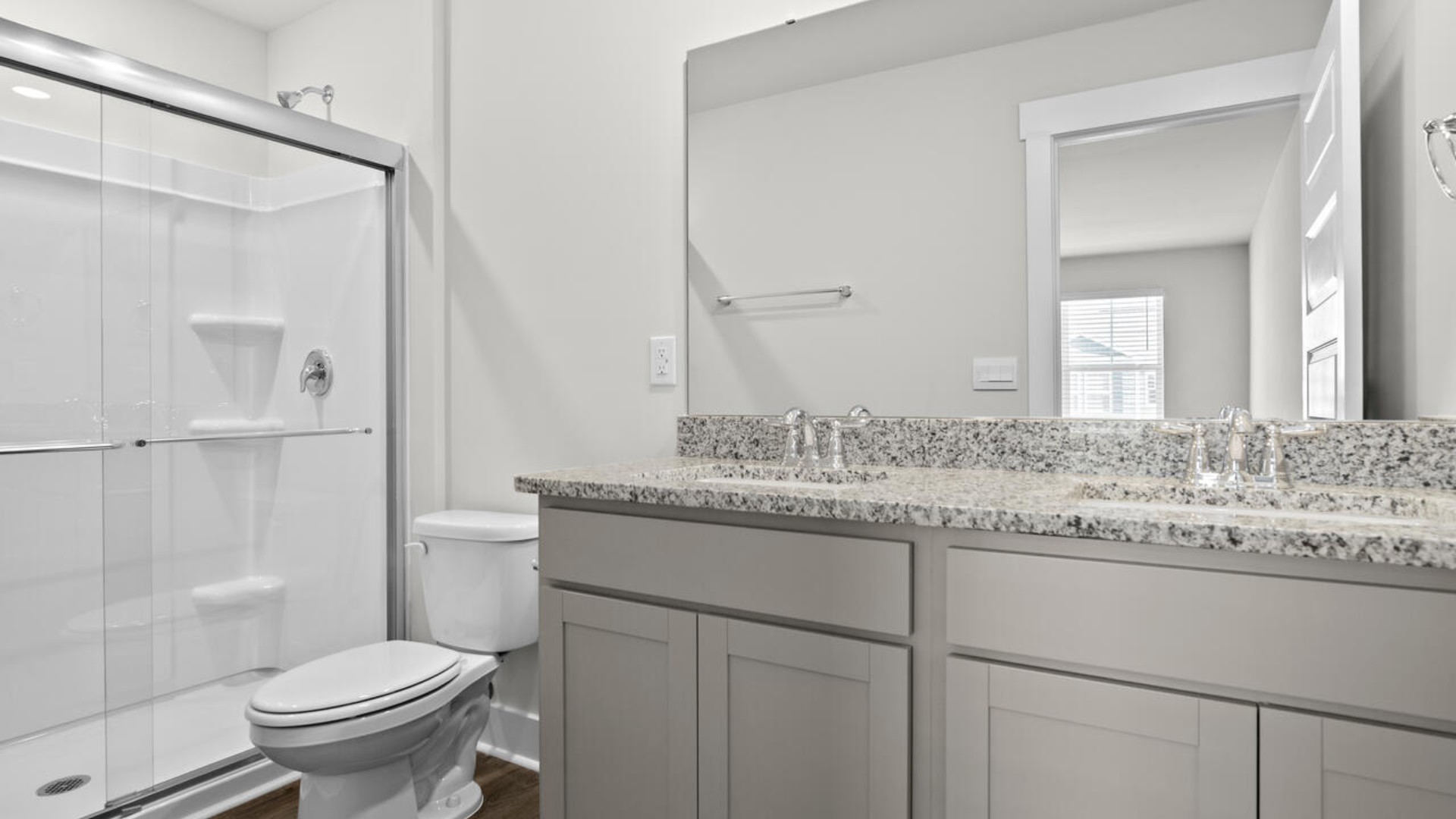 The second floor features the primary bedroom with a walk-in closet and double vanities. I