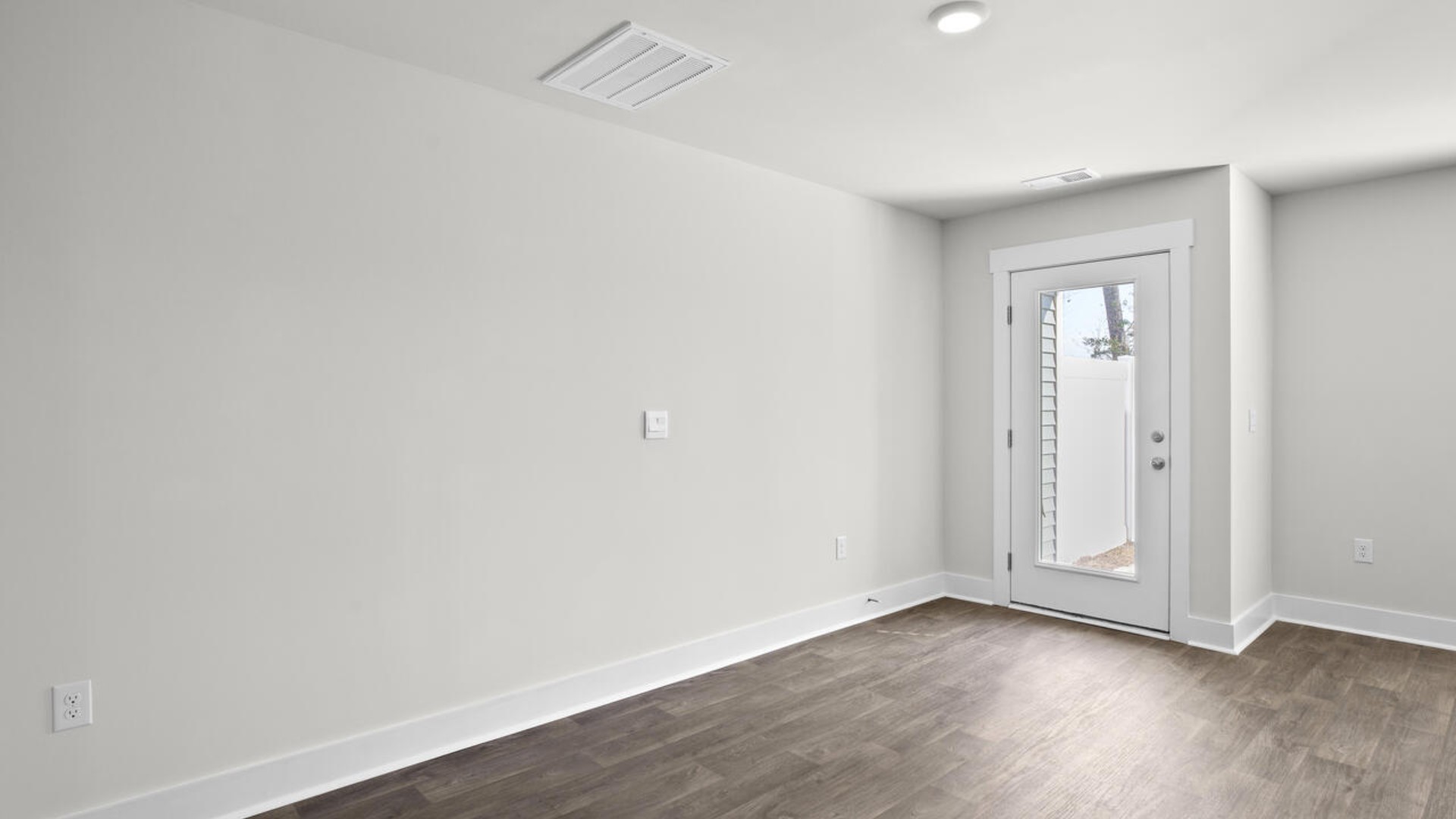 The kitchen overlooks the dining and living spaces, ideal for entertaining guests or enjoying family time while preparing meals with new stainless-steel appliances and granite countertops.