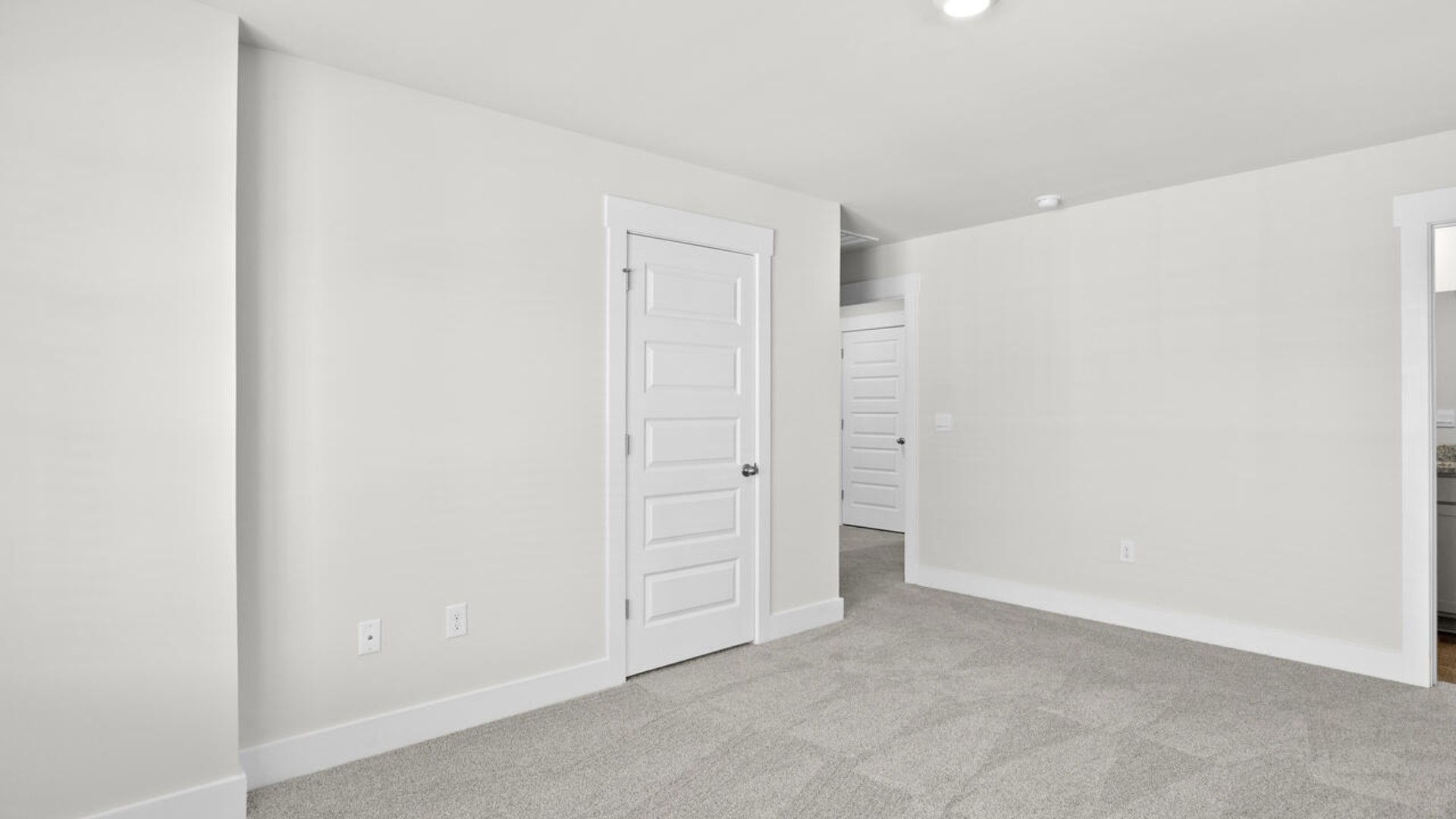 The second floor features the primary bedroom with a walk-in closet and double vanities