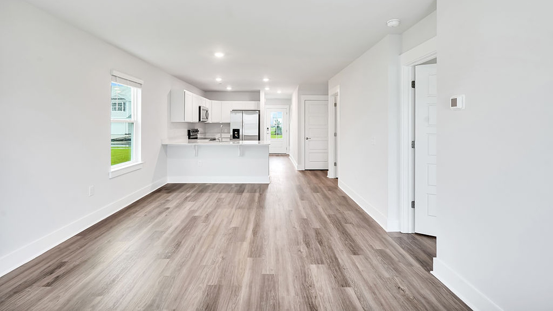 The Primary bedroom is located on the first floor with a large primary suite and bath with double vanities and walk in shower.