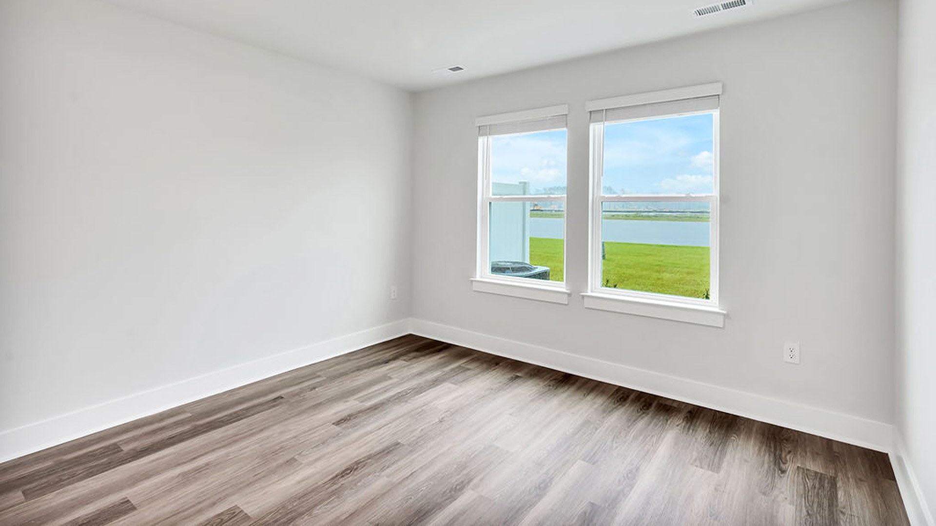 The Primary bedroom is located on the first floor with a large primary suite and bath with double vanities and walk in shower.