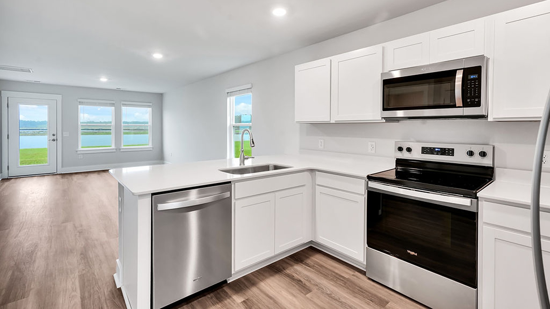The kitchen features shaker-style cabinets, granite countertops, and stainless-steel appliances, which are sure to both turn heads and make meal prep easy.