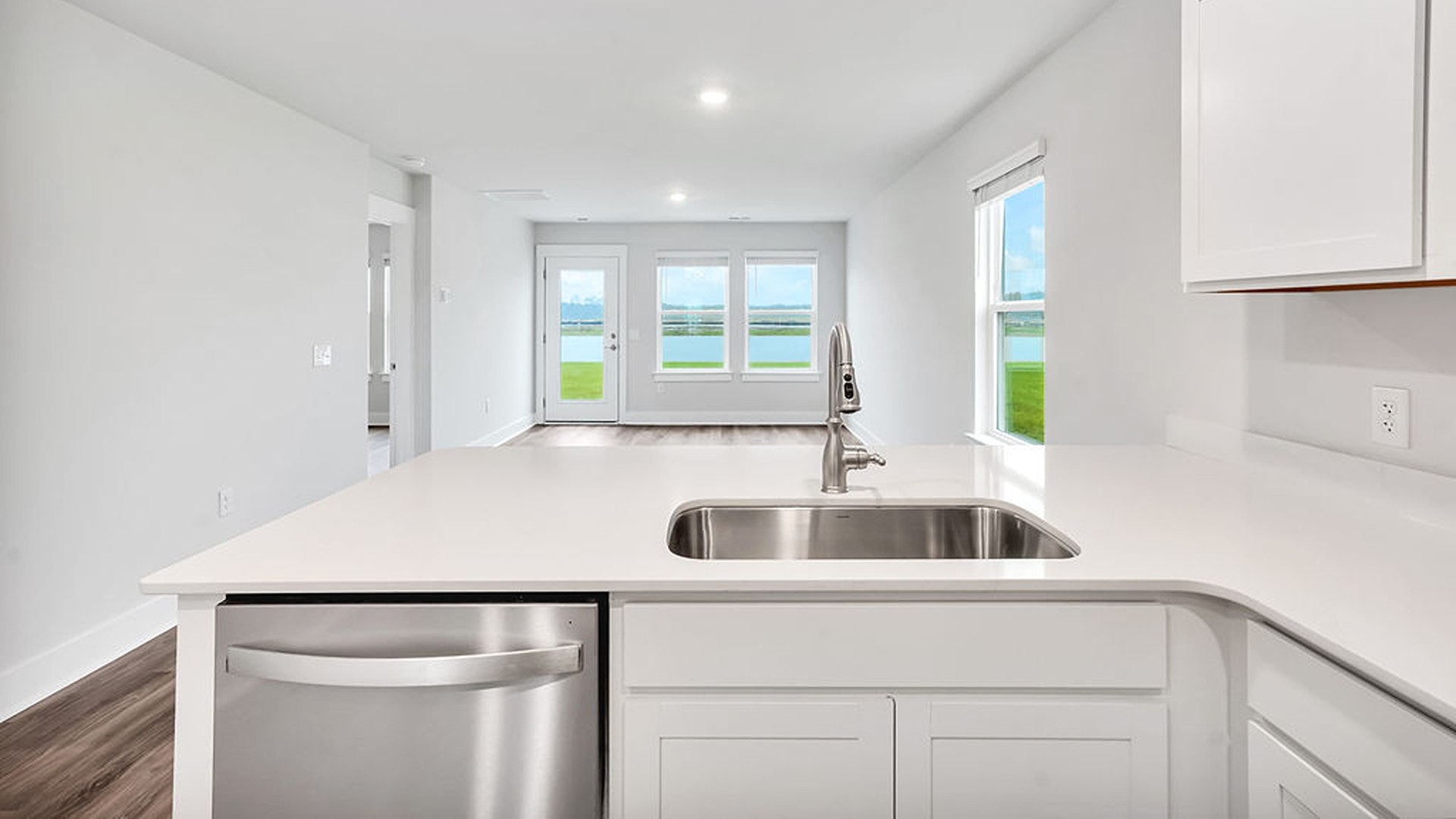 The kitchen features shaker-style cabinets, granite countertops, and stainless-steel appliances, which are sure to both turn heads and make meal prep easy.