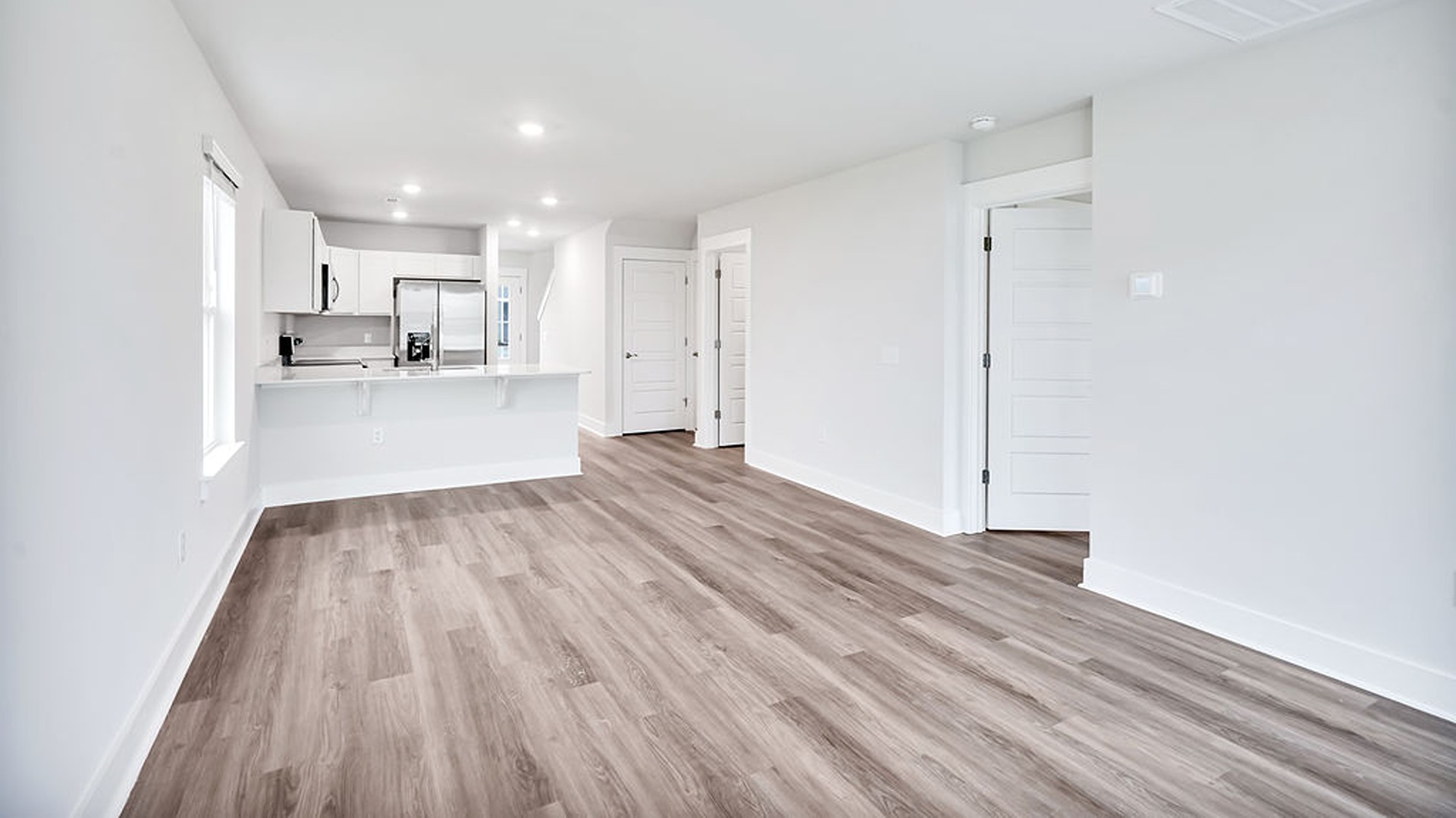 Your new Easley features an open concept first floor anchored by a spacious kitchen with a peninsula bar that overlooks your family and dining room.