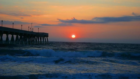Discover white sand and sparkling water along the beach and the Intracoastal Waterway just begging for watersports activities, swimming, sunbathing, beachcombing, fishing and surfing. Named one of the last best American beach towns, Wrightsville Beach is known for its clean, spacious beach and picturesque setting. Strolling about the village-like town offers scenic views no matter whether you are oceanfront, harbor side or at a marina. It’s a place so magical the sun both rises and sets over the water. Generations have visited this beach destination voted North Carolina’s best beach.