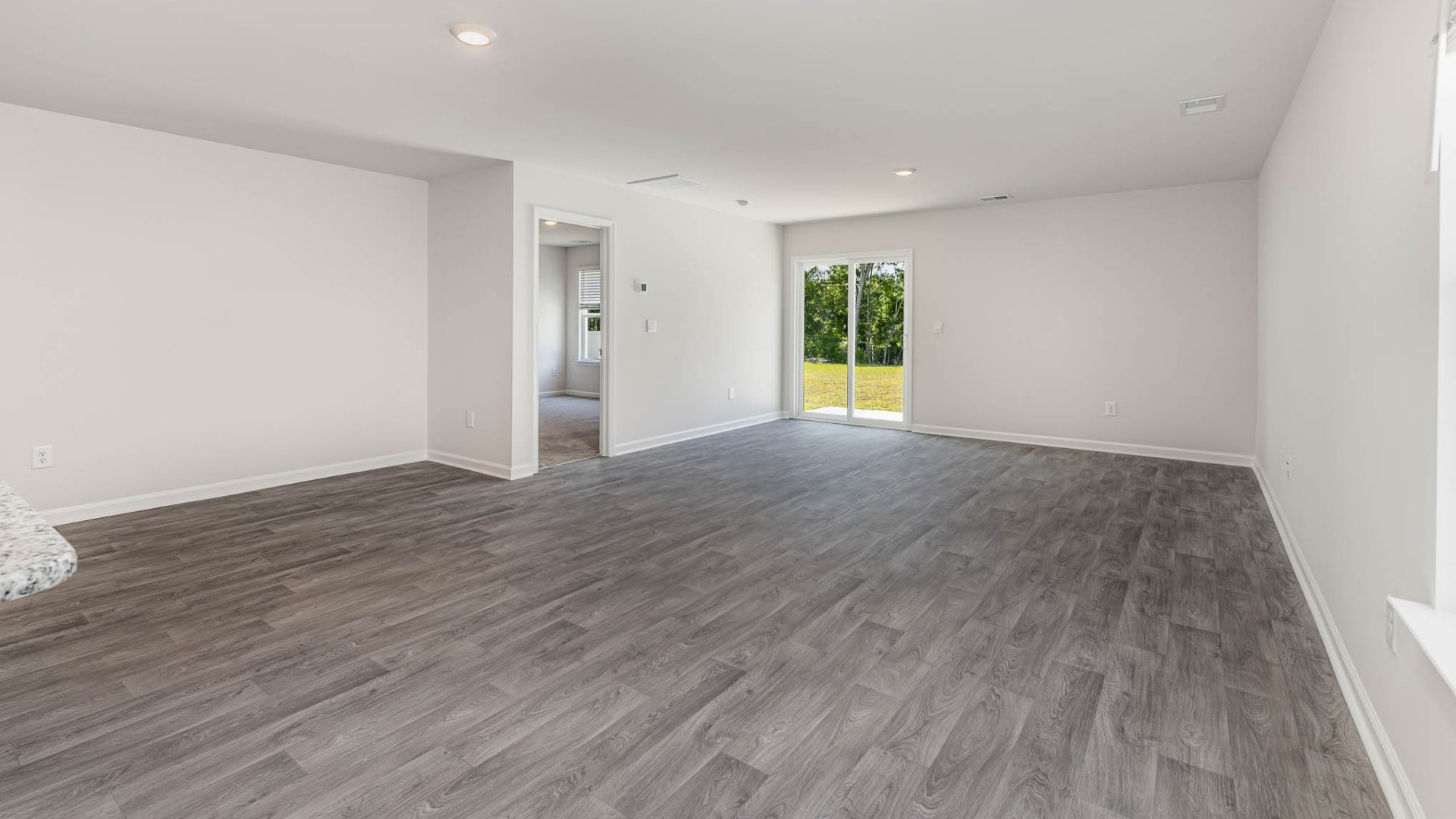 New Homes in Leland NC. The Wren is a two-story floorplan with ample living space featuring an open concept first floor with a large island overlooking the dining area and family room. The primary bedroom suite and laundry room are conveniently located on the first floor, as well.