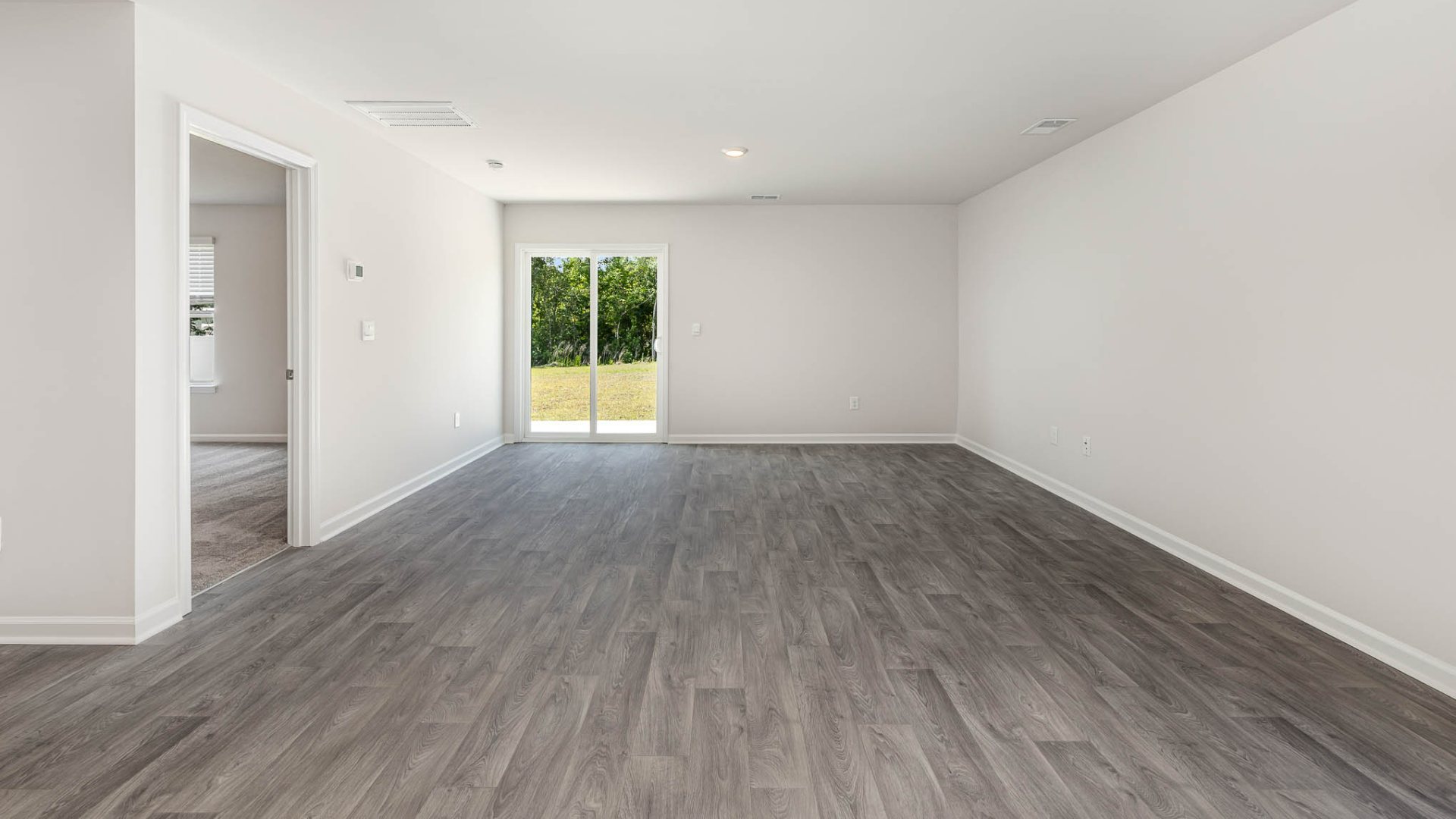 New Homes in Leland NC. The Wren is a two-story floorplan with ample living space featuring an open concept first floor with a large island overlooking the dining area and family room. The primary bedroom suite and laundry room are conveniently located on the first floor, as well.