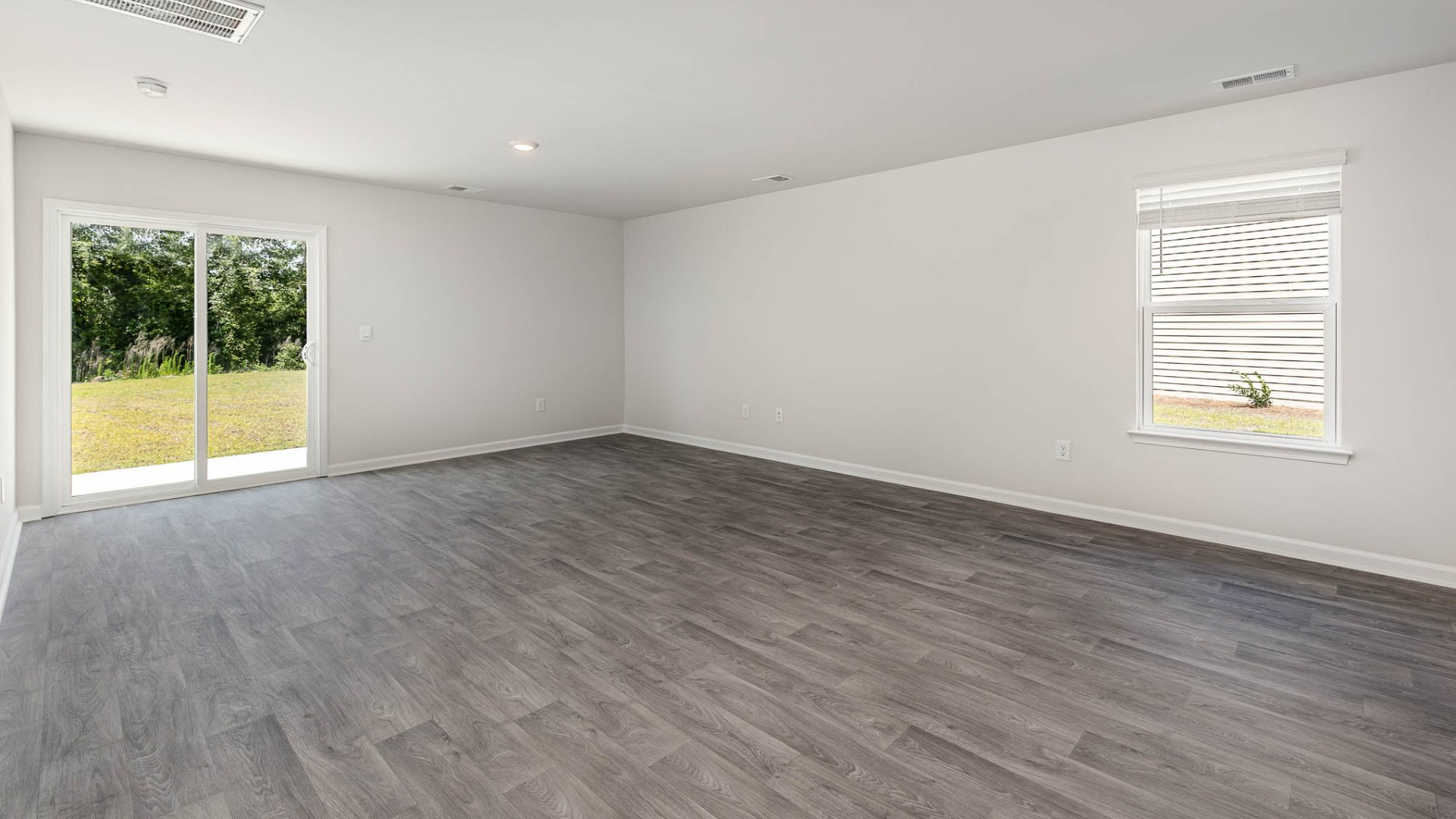 New Homes in Leland NC. The Wren is a two-story floorplan with ample living space featuring an open concept first floor with a large island overlooking the dining area and family room. The primary bedroom suite and laundry room are conveniently located on the first floor, as well.