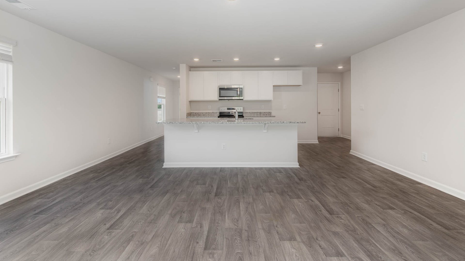 New Homes in Leland NC. The Wren is a two-story floorplan with ample living space featuring an open concept first floor with a large island overlooking the dining area and family room. The primary bedroom suite and laundry room are conveniently located on the first floor, as well.