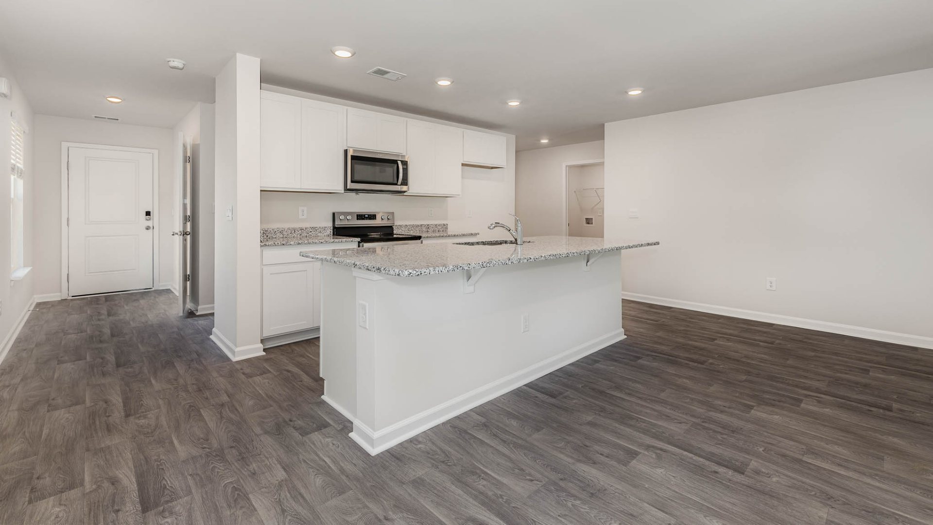 New Homes in Leland NC. The Wren is a two-story floorplan with ample living space featuring an open concept first floor with a large island overlooking the dining area and family room. The primary bedroom suite and laundry room are conveniently located on the first floor, as well.