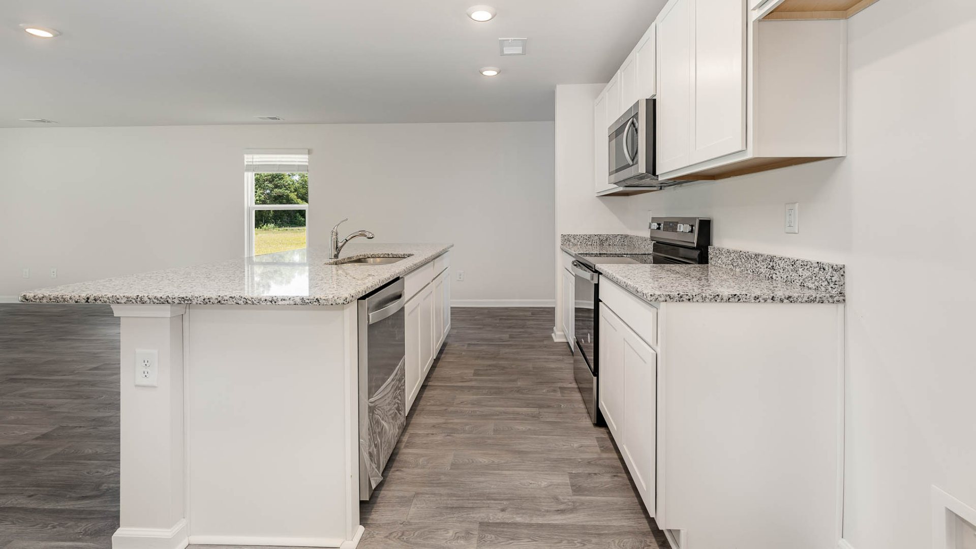 New Homes in Leland NC. The Wren is a two-story floorplan with ample living space featuring an open concept first floor with a large island overlooking the dining area and family room. The primary bedroom suite and laundry room are conveniently located on the first floor, as well.