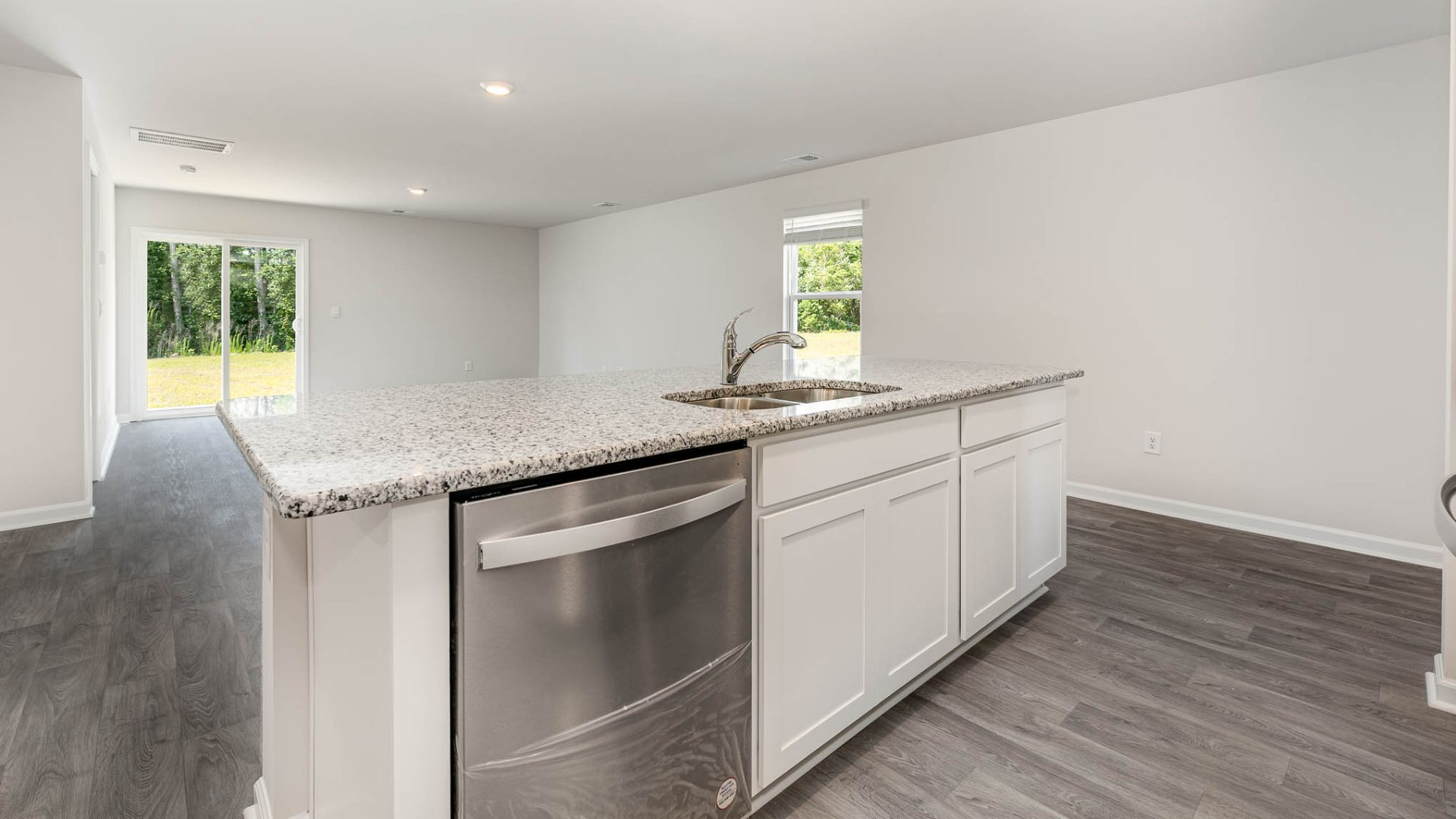 New Homes in Leland NC. The Wren is a two-story floorplan with ample living space featuring an open concept first floor with a large island overlooking the dining area and family room. The primary bedroom suite and laundry room are conveniently located on the first floor, as well.