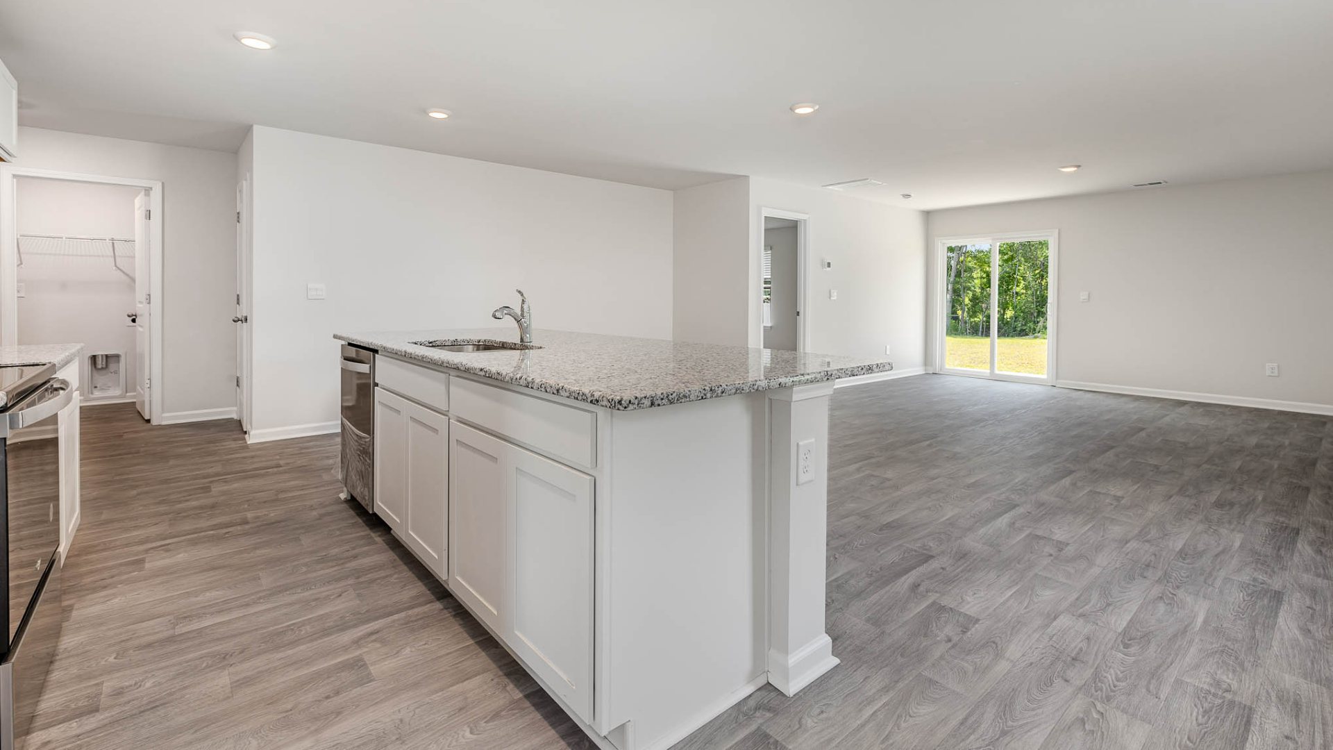 New Homes in Leland NC. The Wren is a two-story floorplan with ample living space featuring an open concept first floor with a large island overlooking the dining area and family room. The primary bedroom suite and laundry room are conveniently located on the first floor, as well.