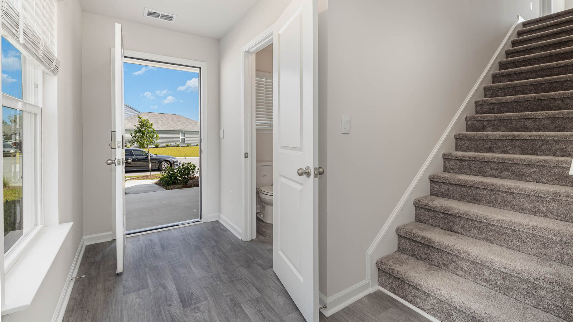 New Homes in Leland NC. The Wren is a two-story floorplan with ample living space featuring an open concept first floor with a large island overlooking the dining area and family room. The primary bedroom suite and laundry room are conveniently located on the first floor, as well.