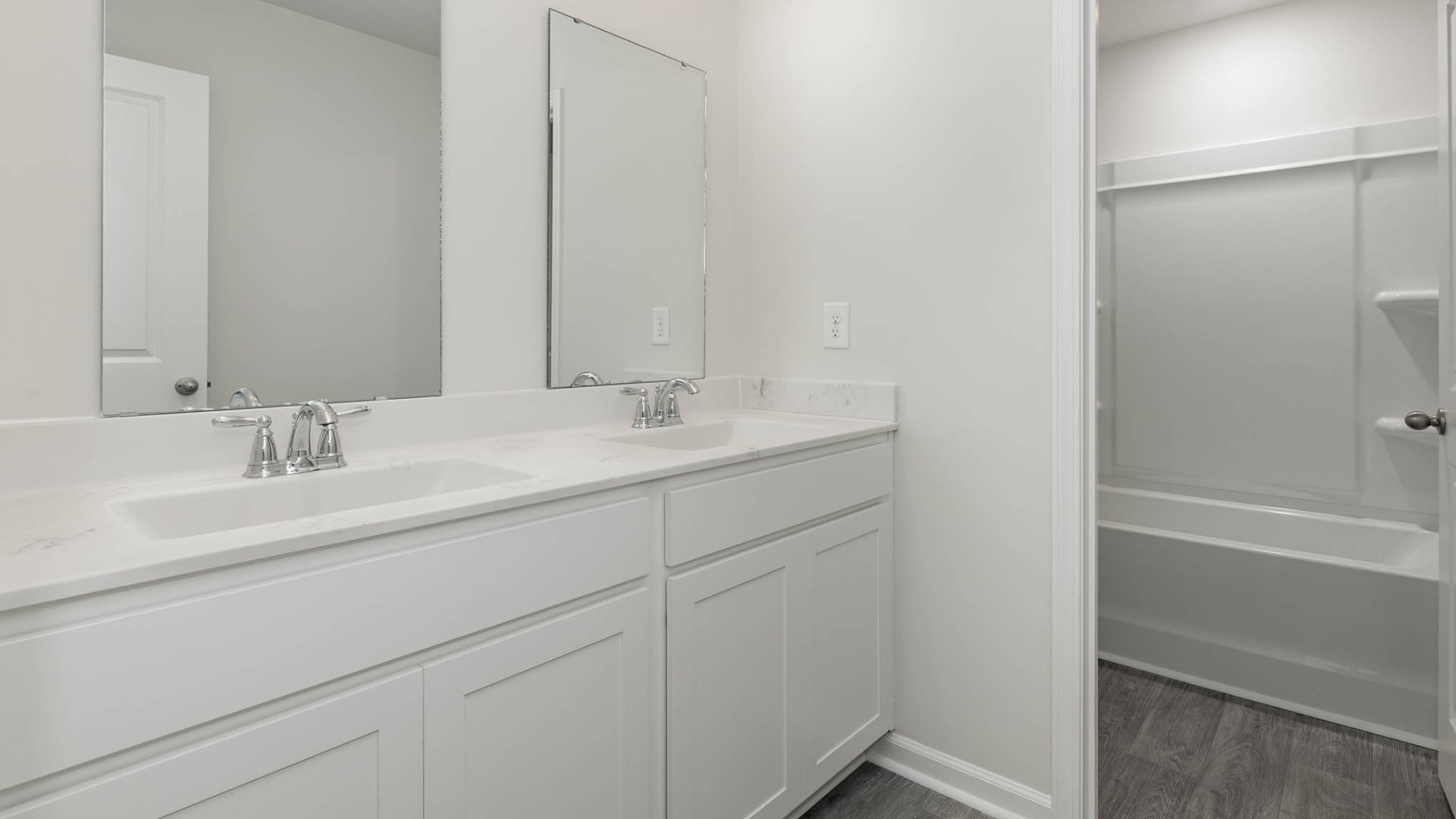 New Homes in Leland NC. The Wren is a two-story floorplan with ample living space featuring an open concept first floor with a large island overlooking the dining area and family room. The primary bedroom suite and laundry room are conveniently located on the first floor, as well.