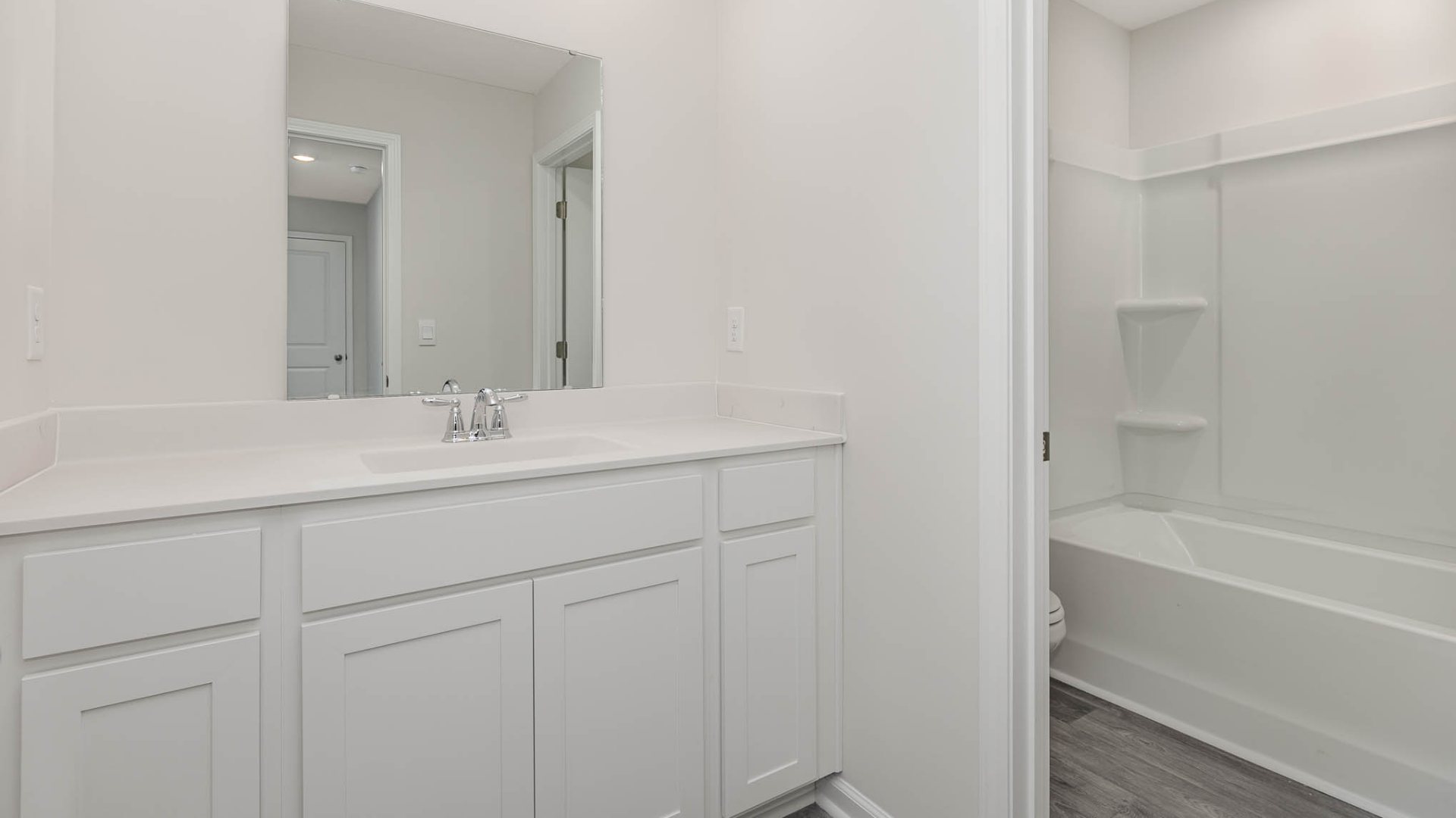 New Homes in Leland NC. The Wren is a two-story floorplan with ample living space featuring an open concept first floor with a large island overlooking the dining area and family room. The primary bedroom suite and laundry room are conveniently located on the first floor, as well.