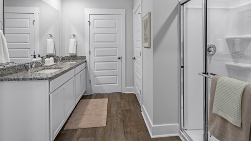 The primary bedroom has its own attached bathroom that features a walk-in closet and all the space you need to get ready in the morning. Sharing a sink isn’t a worry with the double vanity, and you also get additional privacy with a separate door for the toilet and shower. Enjoy the patio perfect for entertaining and enjoying eastern North Carolina evenings.
