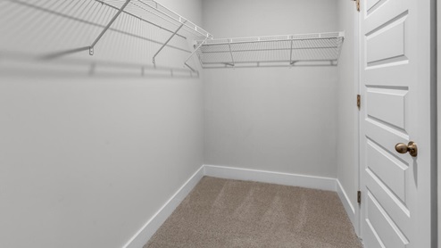 The primary bedroom has its own attached bathroom that features a walk-in closet and all the space you need to get ready in the morning. Sharing a sink isn’t a worry with the double vanity, and you also get additional privacy with a separate door for the toilet and shower. Enjoy the patio perfect for entertaining and enjoying eastern North Carolina evenings.