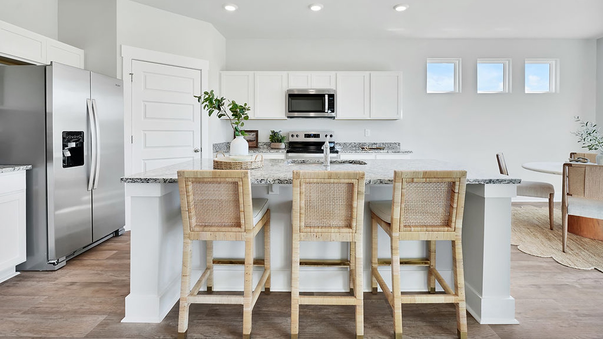 Enjoy coastal living at its best with a screened-in covered porch just off the open-concept kitchen, dining, and living areas — perfect for relaxing or entertaining.