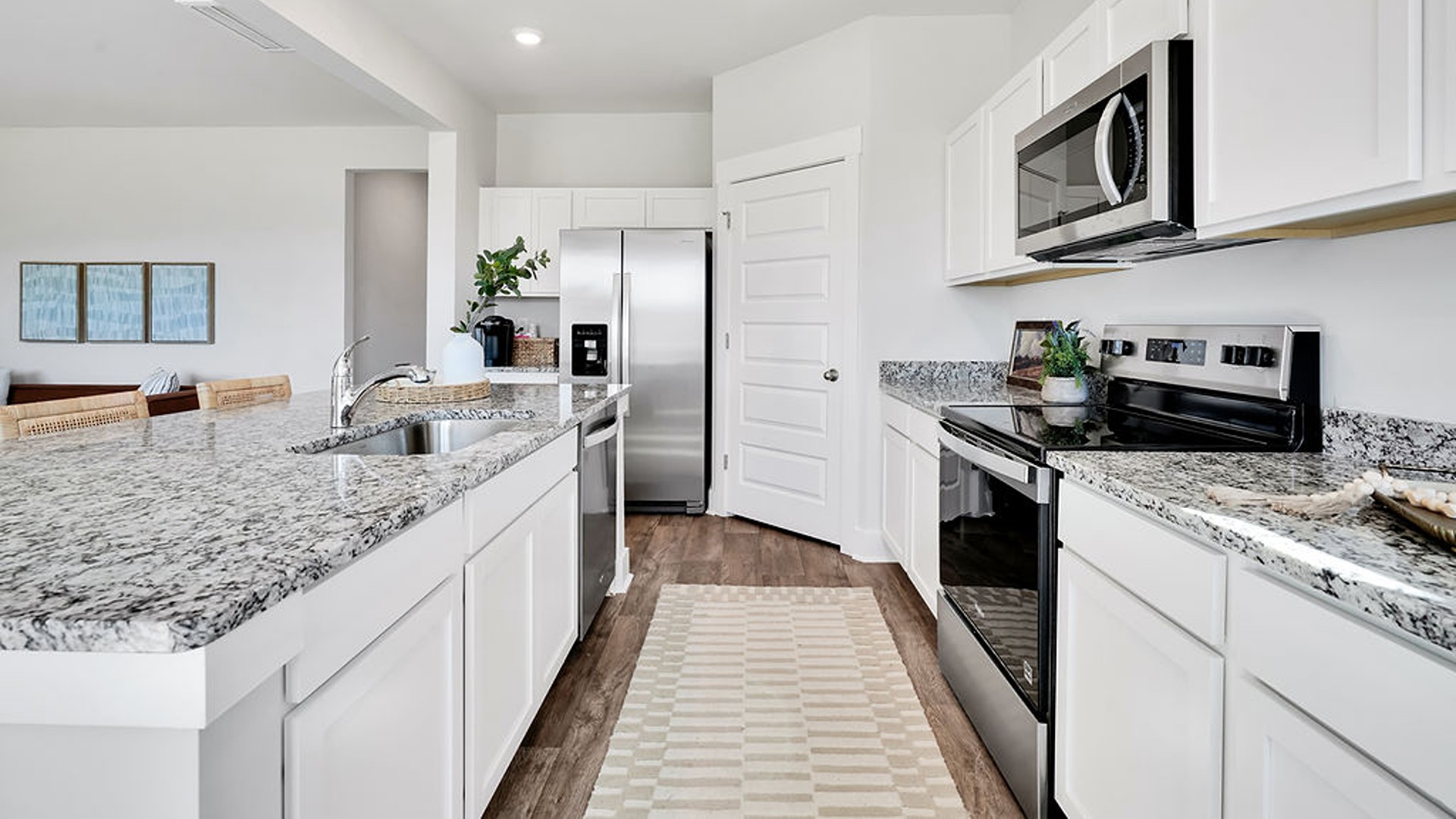 Enjoy coastal living at its best with a screened-in covered porch just off the open-concept kitchen, dining, and living areas — perfect for relaxing or entertaining.