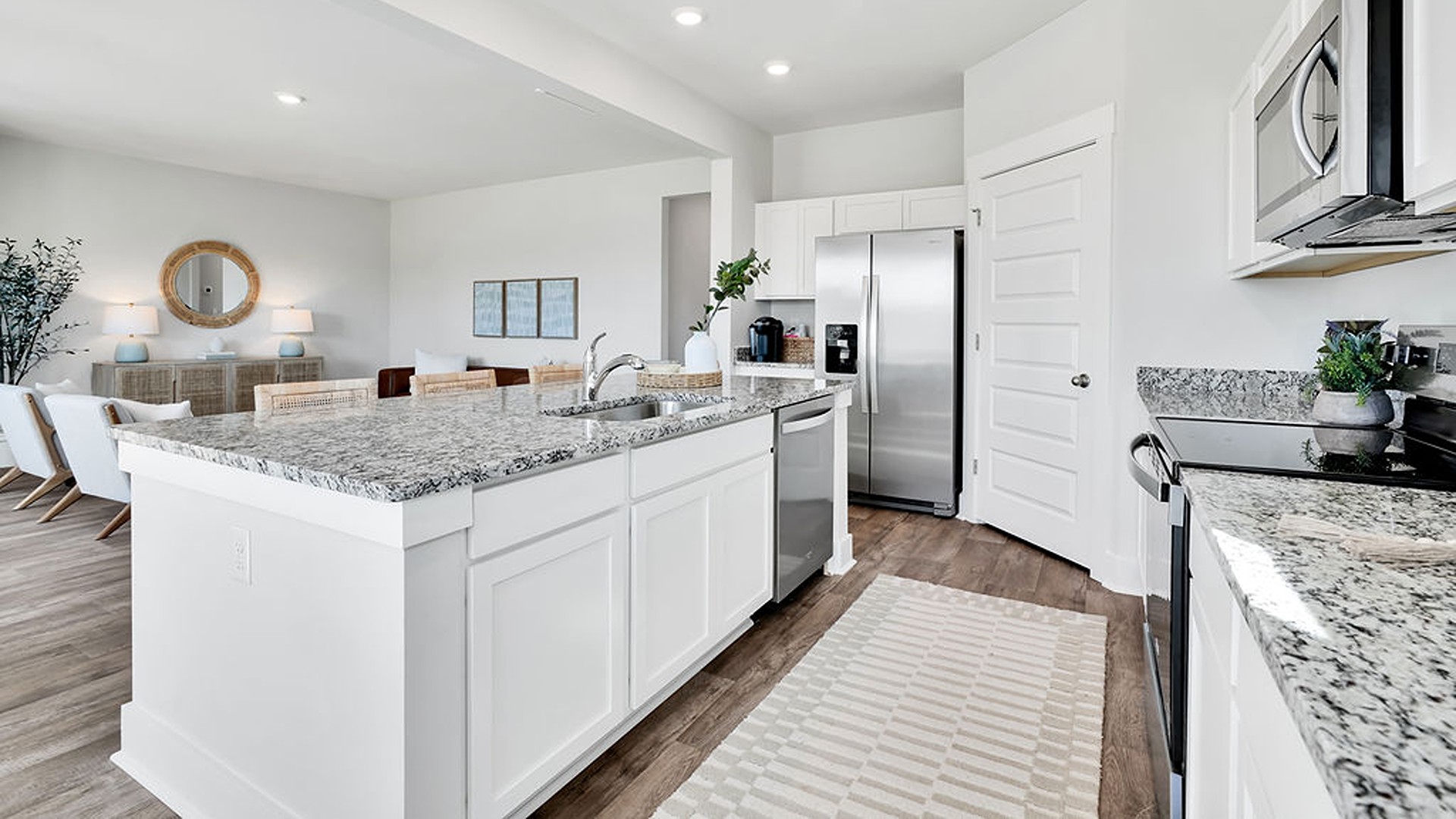 Enjoy coastal living at its best with a screened-in covered porch just off the open-concept kitchen, dining, and living areas — perfect for relaxing or entertaining.