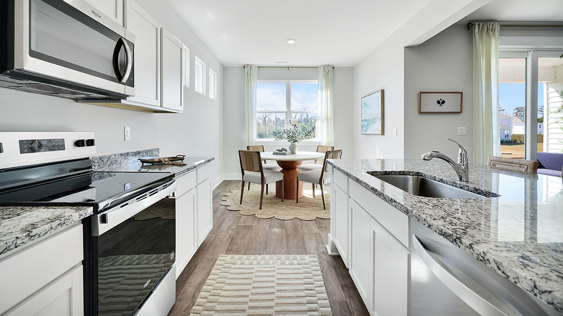 Enjoy coastal living at its best with a screened-in covered porch just off the open-concept kitchen, dining, and living areas — perfect for relaxing or entertaining.