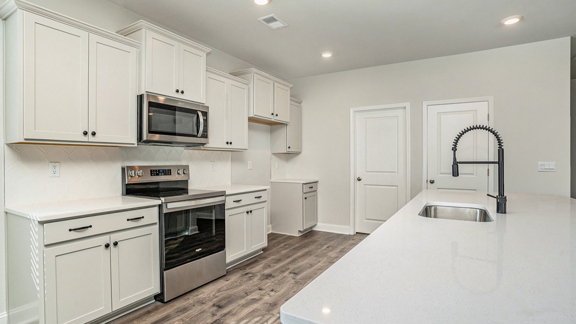 The space seamlessly flows into a dedicated Dining area and a sun-lit Breakfast Nook. The kitchen is strategically placed for convenience, featuring a large walk-in Pantry and easy access to the Laundry and extra storage areas.
