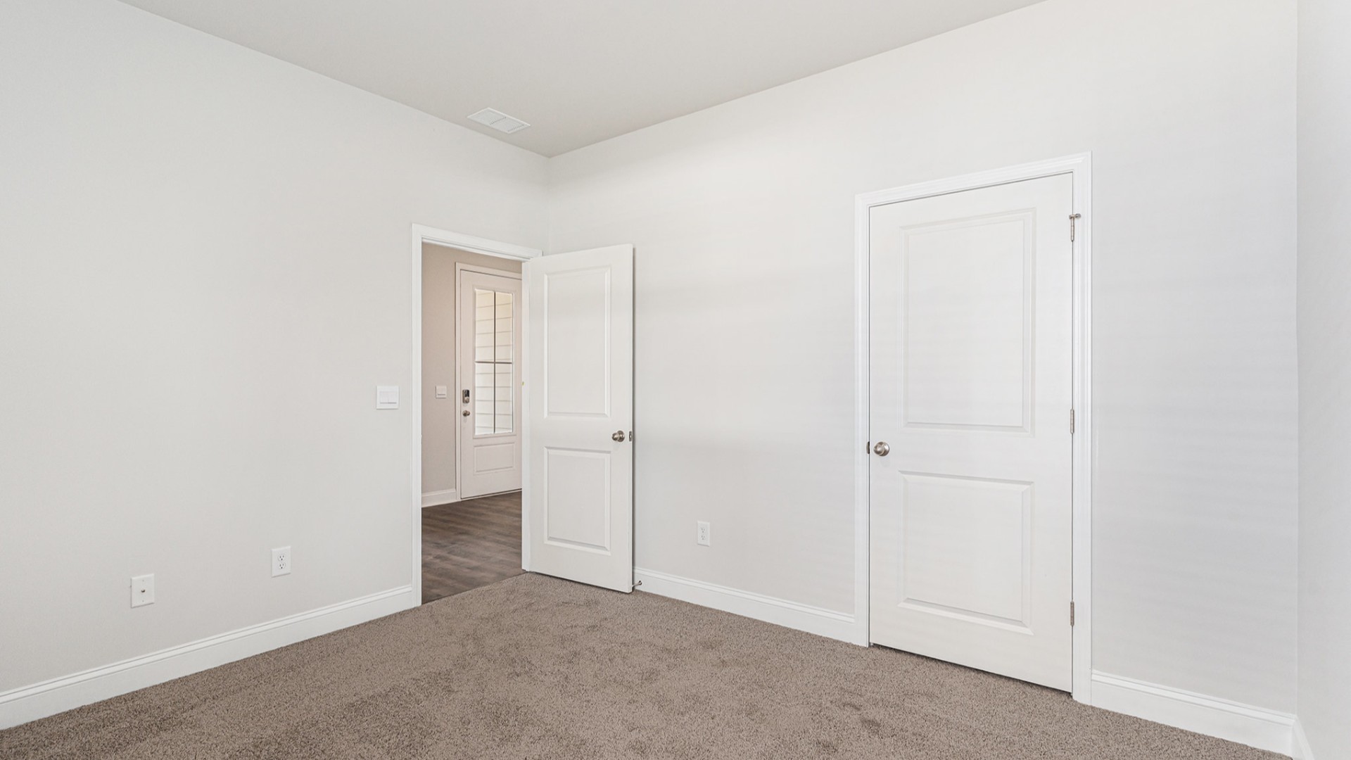 Four additional bedrooms and two full baths ensure plenty of space for family, guests, or a home office.